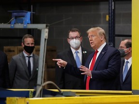 U.S. President Donald Trump tours medical equipment distributor Owens & Minor during the coronavirus disease (COVID-19) pandemic in Allentown, Pa., May 14, 2020.