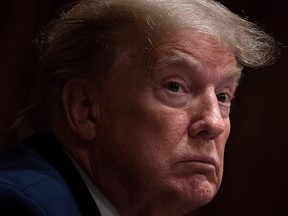 U.S. President Donald Trump listens during a meeting on Opportunity Zones in the Cabinet Room of the White House May 18, 2020, in Washington, D.C.