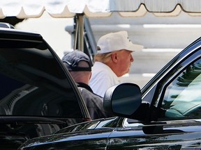 U.S. President Donald Trump walks from a SUV upon return to the White House in Washington, D.C., on May 23, 2020.