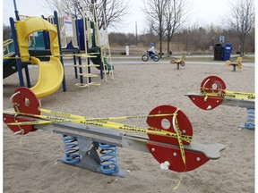 A playground at Woodbine Beach Park near Kingston Rd. and Queen St. East is taped off by the City of Toronto during the COVID-19 pandemic on March 26, 2020.