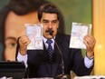 Personal documents are shown by Venezuela's President Nicolas Maduro during a virtual news conference in Caracas, Venezuela May 6, 2020.