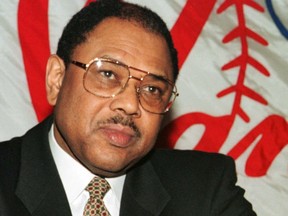 Former New York Yankees general manager Bob Watson listens to new general manager Brian Cashman speak at a news conference at Yankee Stadium, New York, Feb. 3, 1998.