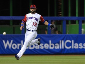 Jose Bautista of the Dominican Republic fields a ball during a game of the 2017 World Baseball Classic against the United States at Miami Marlins Stadium on March 11, 2017 in Miami.