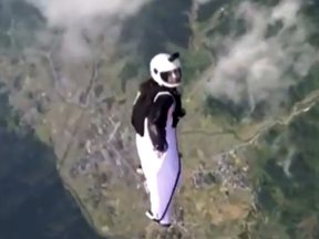 A wingsuit diver's last moments were captured on video before her death in China.