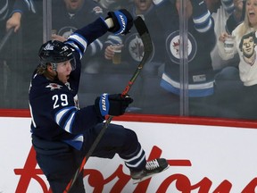 Winnipeg Jets forward Patrik Laine celebrates his second-period goal against the Minnesota Wild during NHL action in Winnipeg on Thurs., Oct. 10, 2019.