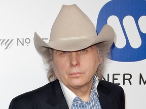 Dwight Yoakam poses as he arrives to attend the Warner Music After Party, in Hollywood, Calif., on Feb. 16, 2016.