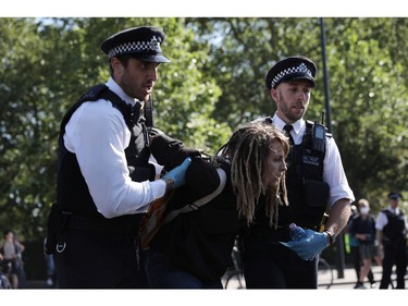 LONDON, ENGLAND - JUNE 01: A protester is held by police as people take part in a 'Black Lives Matter' demonstration on June 01, 2020 in London, England. Protests and riots continue across American following the death of George Floyd, who died after being restrained by Minneapolis police officer Derek Chauvin. Chauvin, 44, was charged last Friday with third-degree murder and second-degree manslaughter.