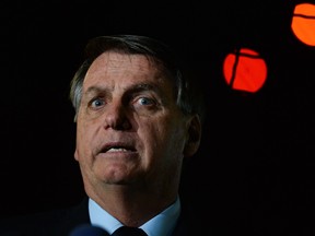 President of Brazil Jair Bolsonaro speaks with press at Alvorada Palace on June 5, 2020 in Brasilia, Brazil.