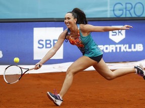 Jelena Jankovic returns the ball  during a tennis doubles match against Nenad Zimonjic and Olga Danilovic at a charity tournament prior to the Adria Tour tennis event, in Belgrade, Serbia, Friday, June 12, 2020.