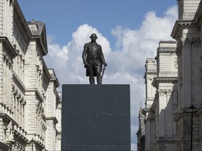 A Grade II-listed bronze statue of Robert Clive, located on King Charles Street in Whitehall is boarded up to prevent vandalism, on June 18, 2020 in London. Robert Clive served as the first Governor of Bengal Presidency under the East India Company in the 18th century.