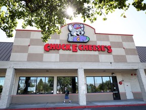 A sign is posted on the exterior of a Chuck E. Cheese's restaurant on June 25, 2020 in Pinole, Calif.