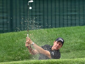 Phil Mickelson of the United States plays a shot from a bunker on the eighth hole during the first round of the Travelers Championship at TPC River Highlands on June 25, 2020 in Cromwell, Connecticut.