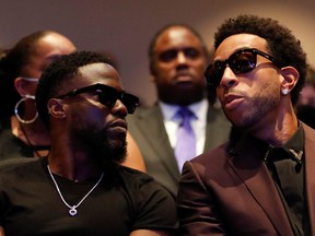 Actor Kevin Hart, left, and musician Ludacris attend a memorial service for George Floyd following his death in Minneapolis police custody, in Minneapolis, Minnesota, June 4, 2020.