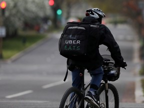 An Uber Eats bicyclist makes a delivery during the coronavirus outbreak, in the U.S. Capitol Hill neighbourhood in Washington, April 1, 2020.