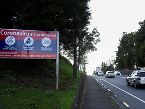 Morning traffic passes a warning sign on the first day of all New Zealand domestic regulations being lifted for the coronavirus disease (COVID-19) in Nelson, New Zealand, June 9, 2020.