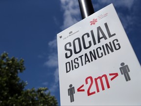 A social distance sign is pictured, amid the spread of the COVID-19 in Oxford Street in London, June 14, 2020.