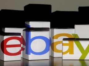 An eBay logo is projected onto white boxes in this illustration picture taken in Warsaw, Jan. 21, 2014.