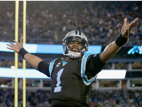 Cam Newton #1 of the Carolina Panthers reacts after a 4th quarter touchdown against the Tampa Bay Buccaneers  during their game at Bank of America Stadium on January 3, 2016 in Charlotte, North Carolina.