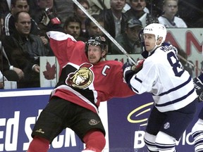 Former rivals Daniel Alfredsson (left) and Alexander Mogilny, seen here battling in the playoffs while with Ottawa and Toronto, respectively, are two of the players believed to be on the bubble for hockey hall of fame selection this year. Jarome Iginla is regarded as a shoo-in.