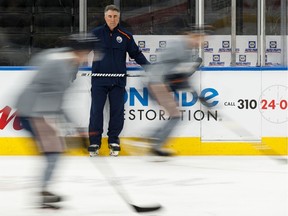 Edmonton Oilers head coach Dave Tippett watches his players during a practice on the ice at Rogers Place on Feb. 7, 2020. When the Oilers return to play, Tippett will need to base his lineup decisions on what he sees in practice.