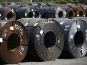 Steel coils lay in a yard at ArcelorMittal Dofasco steel plant on June 4, 2018 in Hamilton, Ont.