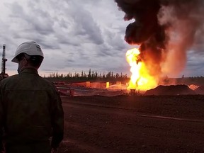 Flames and smoke rise from the site of a fire at the Yarakta oil field, operated by a subsidiary of the Irkutsk Oil Company, in Irkutsk region, Russia, in this screen grab taken from video released June 8, 2020.