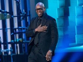 Comedian Dave Chappelle arrives on stage at the Kennedy Center for the Mark Twain Award for American Humor on October 27, 2019 in Washington, DC.
