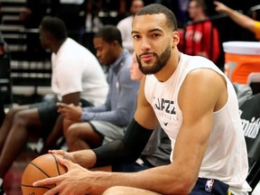 In this file photo taken on December 4, 2019  Utah Jazz center Rudy Gobert cools down after warm ups before a NBA game against Los Angeles Lakers in Salt Lake City, Utah.