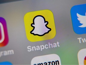 In this file photo  taken on October 1, 2019 in Lille  the logo of mobile app Snapchat is displayed on a tablet.
