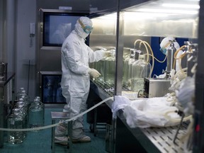 A researcher works in a lab at the Yisheng Biopharma company in Shenyang, in Chinas northeast Liaoning province on June 10, 2020. The company is one of a number in China trying to develop a vaccine for the COVID-19 coronavirus.