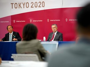 Tokyo 2020 organizing committee President Yoshiro Mori, right, and CEO Toshiro Muto, left, attend a press conference in Tokyo on June 10, 2020.
