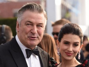 Actor Alec Baldwin (left) and wife Hilaria Baldwin walk the red carpet at the 25th Annual Screen Actors Guild Awards at the Shrine Auditorium in Los Angeles on Jan. 27, 2019.