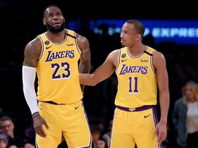LeBron James of the Los Angeles Lakers reacts to Avery Bradley after an injury at Staples Center on March 6, 2020 in Los Angeles.
