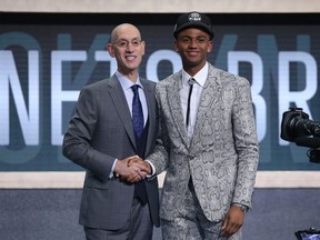 Nickeil Alexander Walker (Virginia Tech) greets NBA commissioner Adam Silver after being selected as the number seventeenth overall pick to the Brooklyn Nets in the first round of the 2019 NBA Draft at Barclays Center.