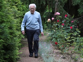 103-year-old Belgian oldest former general practitioner Alfons Leempoels walks in his garden intending to cover a distance equivalent of a marathon to raise money for scientists researching the coronavirus disease (COVID-19) in Rotselaar, Belgium June 9, 2020.