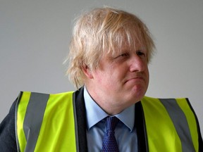 Britain's Prime Minister, Boris Johnson visits a science room under construction at Ealing Fields High School on June 29, 2020 in London.