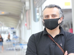 Air passenger Karen Kabiri is shown at Pierre Trudeau International Airport in Montreal, Monday, June 29, 2020.