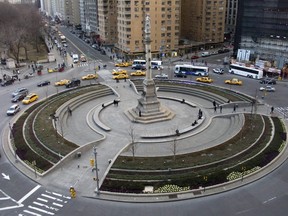 In this Jan. 13, 2008 file photo, traffic goes around  New York's Columbus Circle and its 70-foot-tall column topped by a statue of Christopher Columbus.