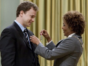 Marc Kielburger from Toronto receives the Order of Canada from Governor General Michaelle Jean during a ceremony at Rideau Hall in Ottawa on Wednesday April 7, 2010.