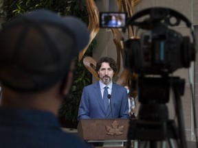 Cameras record Prime Minister Justin Trudeau as he delivers a commencement speech in Ottawa, Wednesday June 10, 2020.