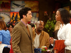 David Schwimmer as Ross Geller, Aisha Tyler as Charlie Wheeler in the NBC sitcom Friends.