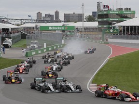 Formula One cars take the first turn at the start of the Formula One Canadian Grand Prix at Circuit Gilles-Villeneuve in Montreal on Sunday, June 12, 2016.