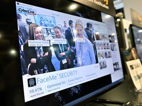 A video monitor displays attendees as their images are captured with CyperLink's facial recognition during CES 2020 at the Las Vegas Convention Center on January 8, 2020 in Las Vegas.