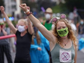 Supporters of the Extinction Rebellion movement dance to disco hits during a protest dance march on June 21, 2020 in Berlin.
