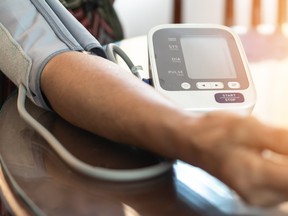 This photo illustration shows an elderly patient getting blood pressure check.