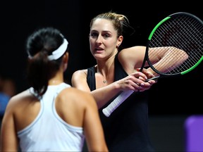 Gabriela Dabrowski, right, of Canada and Xu Yifan of China discuss strategies against Samantha Stosur of Australia and Zhang Shuai of China during their Women's Doubles match on Day Three of the 2019 Shiseido WTA Finals at Shenzhen Bay Sports Center on Oct. 29, 2019 in Shenzhen, China.