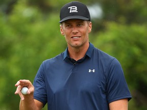 NFL player Tom Brady of the Tampa Bay Buccaneers reacts  during The Match: Champions For Charity at Medalist Golf Club on May 24, 2020 in Hobe Sound, Fla.