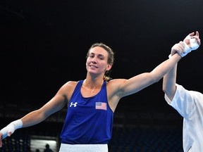 USA's Mikaela Joslin Mayer celebrates winning against Micronesia's Jennifer Chieng fights during the Women's Light (57-60 kg) match at the Rio 2016 Olympic Games at the Riocentro - Pavilion 6 in Rio de Janeiro on August 12, 2016.