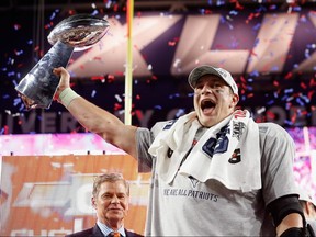 Rob Gronkowski of the New England Patriots celebrates with the Vince Lombardi Trophy after winning Super Bowl XLIX at University of Phoenix Stadium on February 1, 2015 in Glendale.