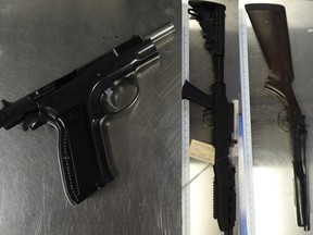 Guns seized by police after a search at a north Edmonton home May 15, 2020.
